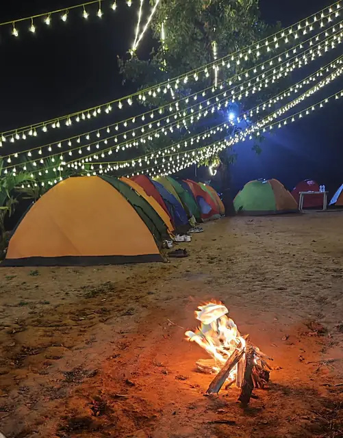 Bonfire night — Campfire evening at the lakeside camp, Vasota Fort trek from Bamnoli