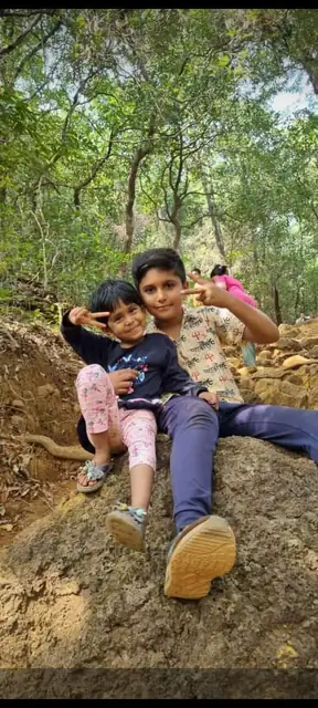 Trail duo — Young trekkers on the path, Vasota Fort trek from Bamnoli